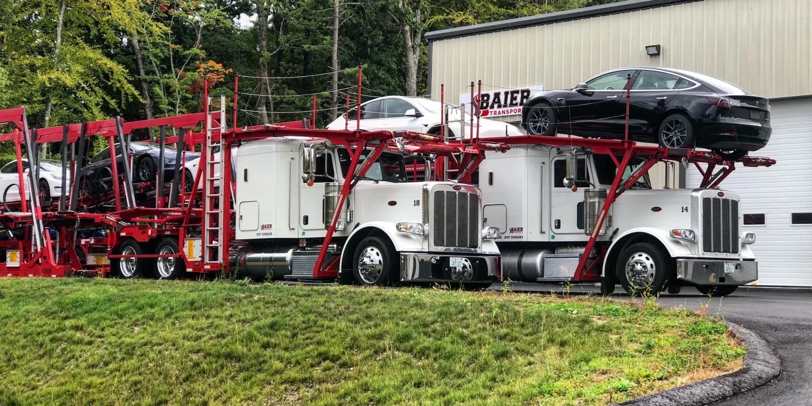 Baier Transport Peterbilt car carriers loaded with vehicles at the Seabrook, NH yard