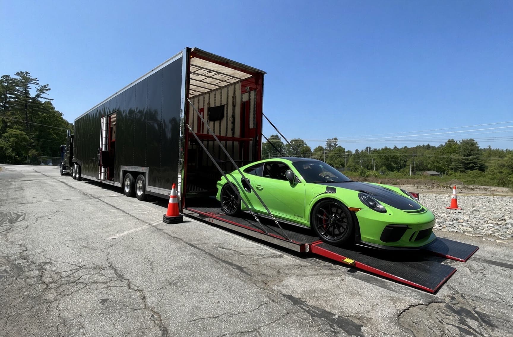Enclosed auto transport by Baier Transport: Porsche GT3 RS loading into an enclosed trailer