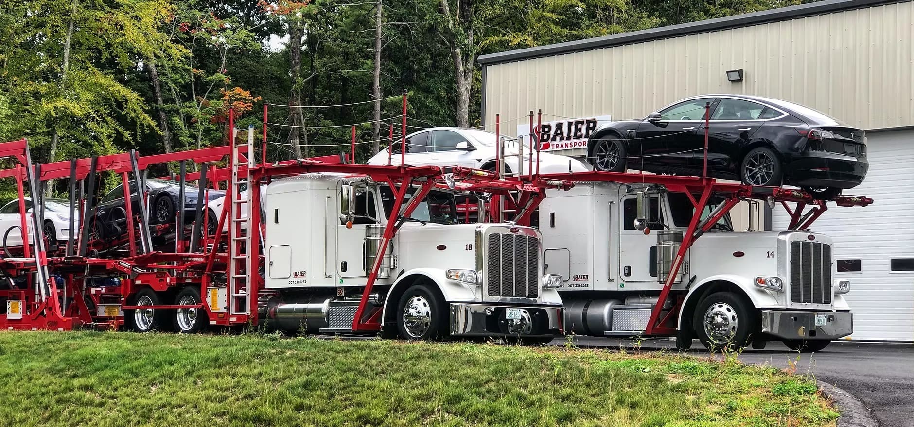 Peterbilt car carriers at Baier Transport facility — dealership auto transport operations guide