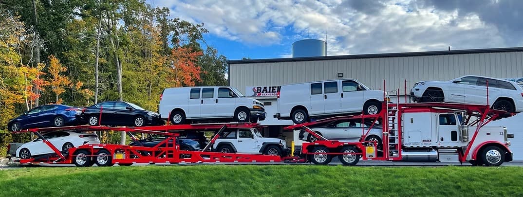 Baier Transport car carrier loaded for seasonal snowbird auto transport